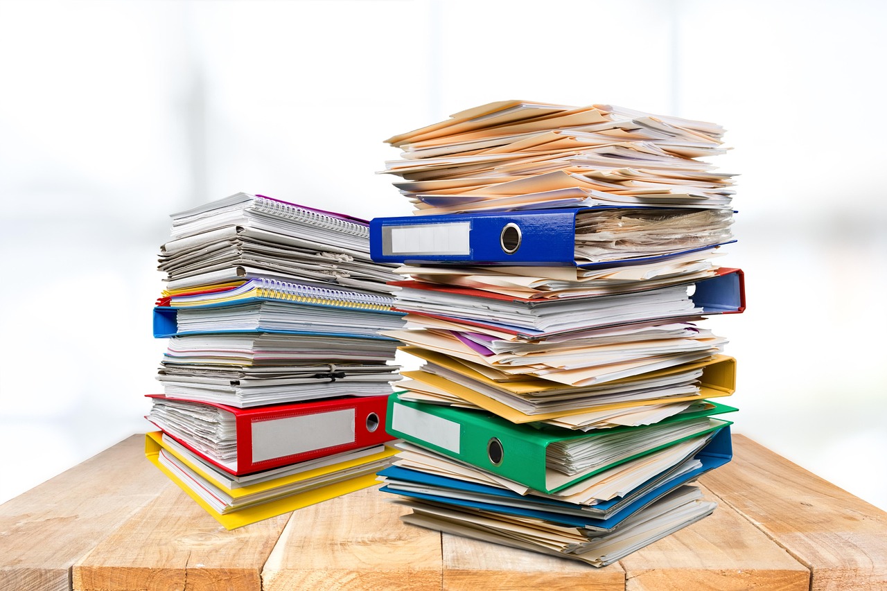 documents papers binder desk